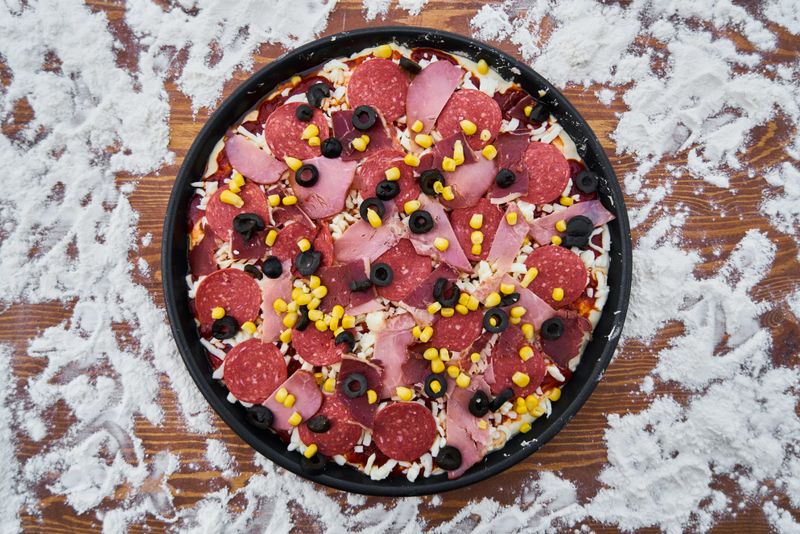 Mediterranean Delight pizza with olives, feta and roasted peppers