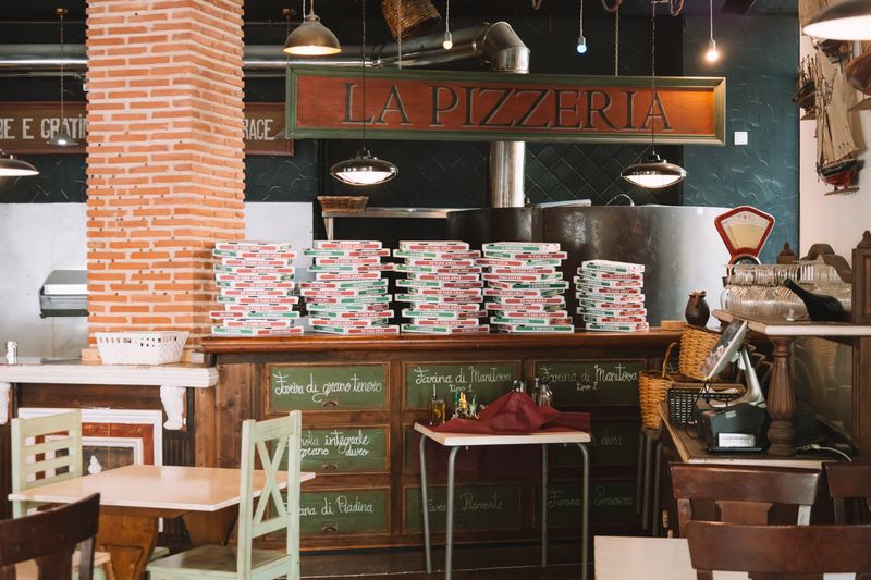 Pizza inn kitchen — handcrafted pizza being prepared